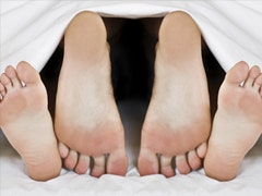 Help! I Have A Boring Sex Life couple's feet in bed