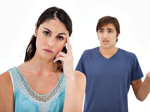 man yelling at frustrated woman