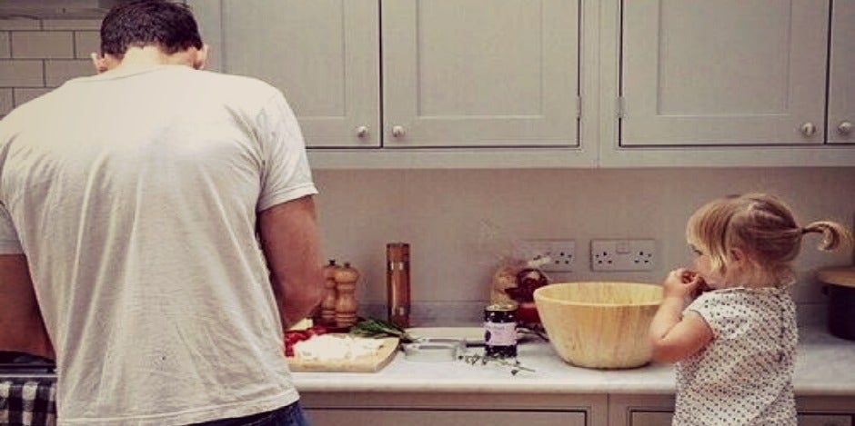 father baking with daughter