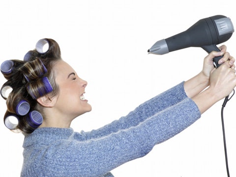 woman using hairdryer
