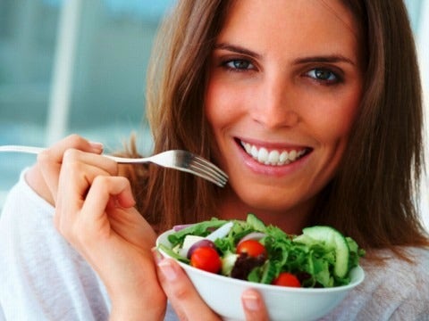 woman eating salad