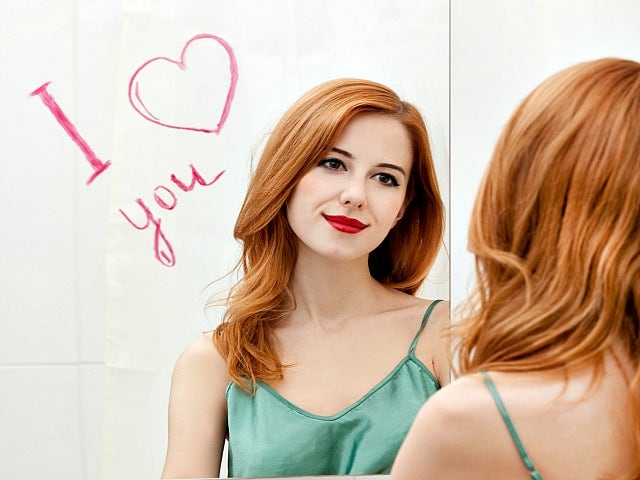 girl looking into the mirror. girl looking into the mirror.