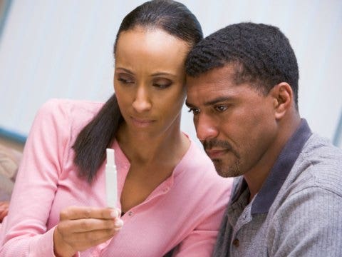 couple looking at pregnancy test