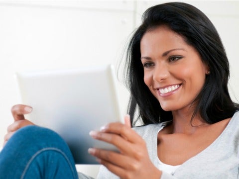 Online Dating Bootcamp: How To Write A Description woman with tablet