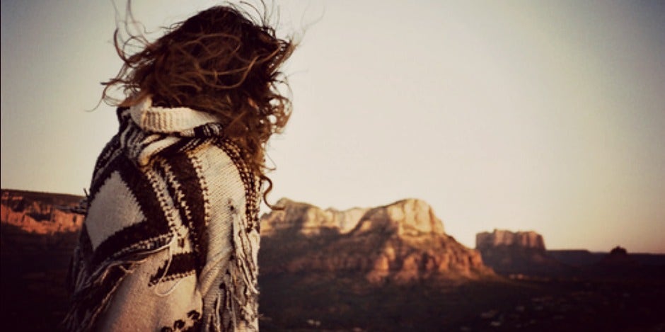 woman standing on a mountain