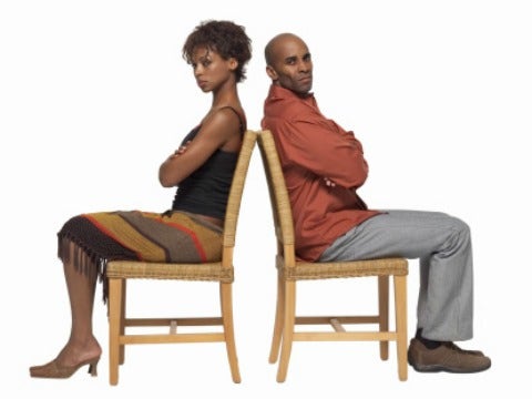 woman and man in back to back chairs