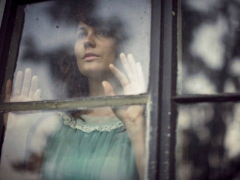 woman looking out of window