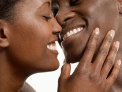 close up of couple smiling about to kiss