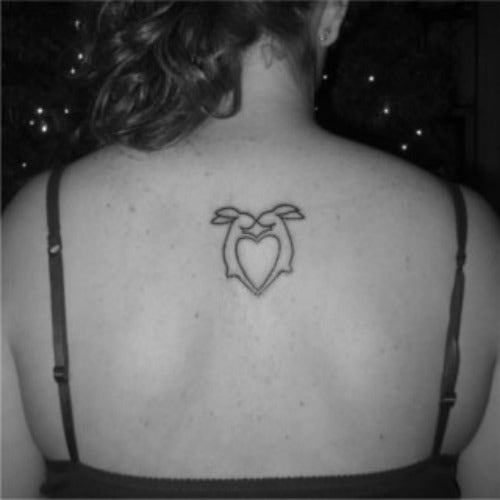 Animal testing bunny heart tattoo