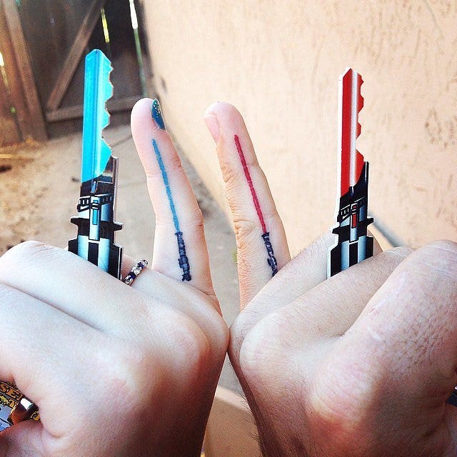 Matching lightsaber best friends tattoo 