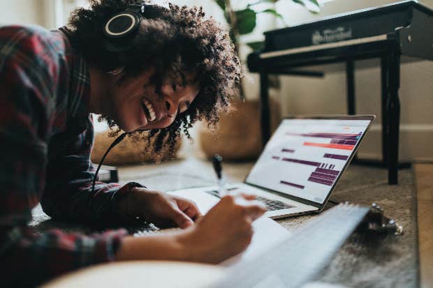 woman listening to music while working