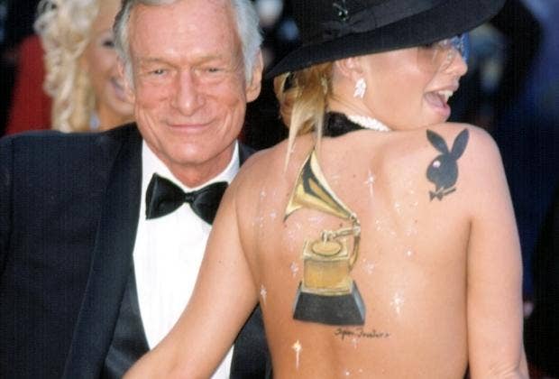 Hugh Hefner with woman at Grammys