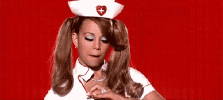Mariah Carey dressed up as a sexy nurse in her "Up Out My Face" music video throwing cash