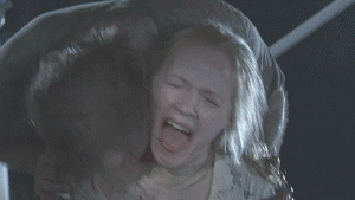 Zombie walker biting Andrea (Laurie Holden) on AMC "The Walking Dead"