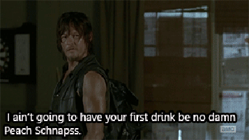 Norman Reedus as Daryl Dixon talking to Emily Kinney as Beth Greene on AMC 'The Walking Dead' about peach Schnapps
