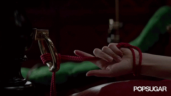 Ok, while this may seem super sensual, in the Christian version she's actually fully clothed and he's just tickling her feet Ana Steele in '50 Shades of Grey' - PopSugar