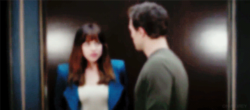 The Christian version of Grey will be hard of hearing, so sometimes he has to stand really close to people to hear what they're saying Ana Steele and Christian Grey in '50 Shades Of Grey' - Giphy