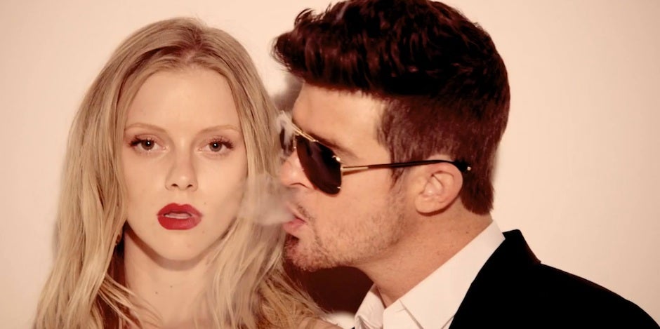 Robin Thicke in Blurred Lines Robin Thicke in Blurred Lines blowing smoke at a blonde model wearing red lipstick