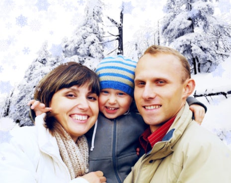 couple with child outside in the snow