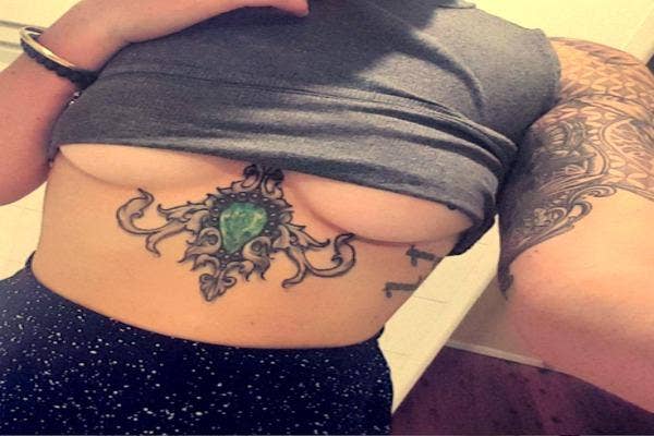 Underboob tattoo.