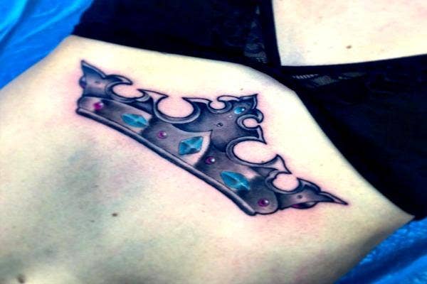 Crown tattoo.