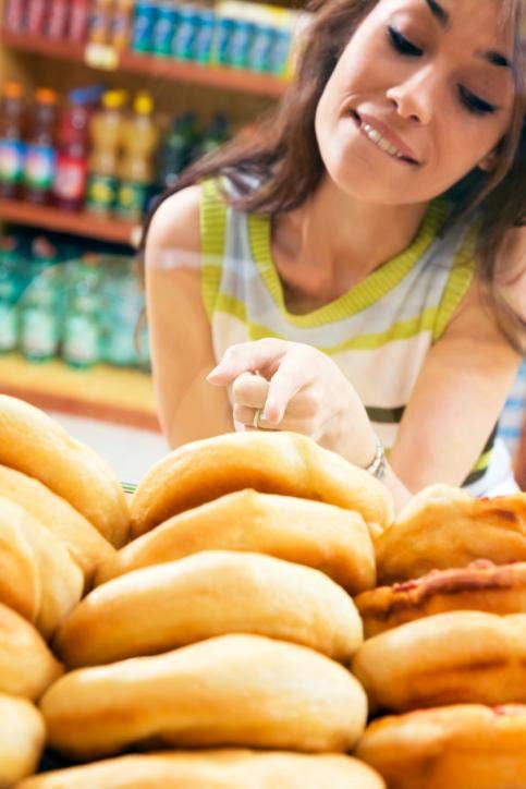 Woman choosing bread