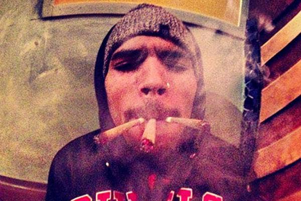 Chris Brown smoking three marijuana blunts at once