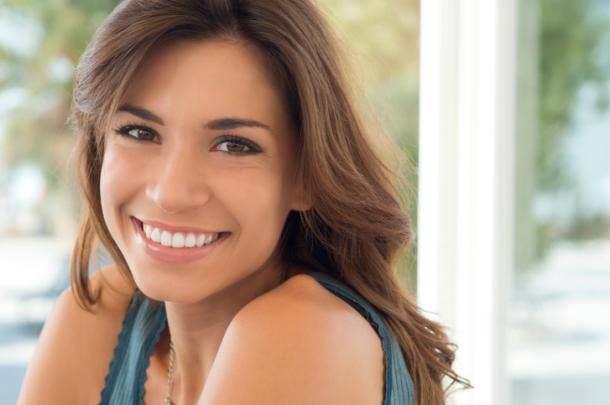 A woman smiling.