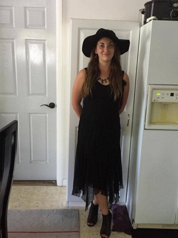 woman in black dress, black hat and shoes