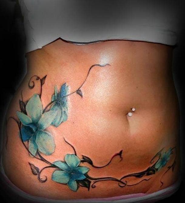 stomach tattoos for women to cover stretch marks