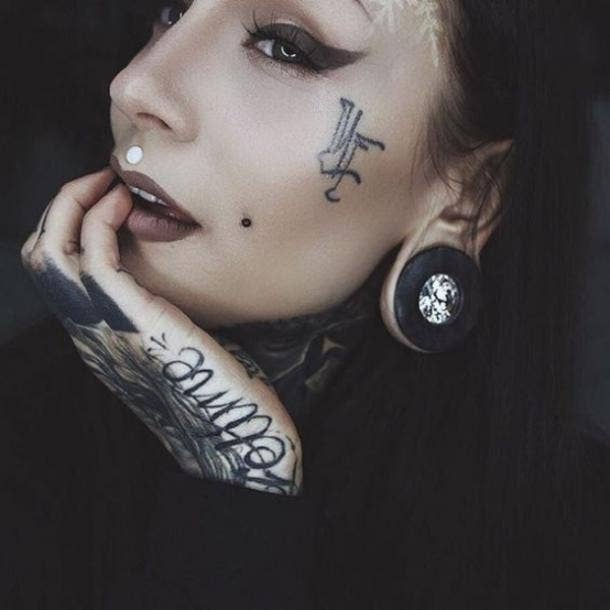 10 Pretty Face Tattoos For Women And Why This Tattoo Trend Has Been Stigmatized For All The Wrong Reasons