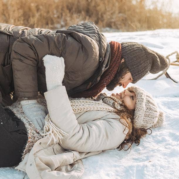 couple kissing in the snow