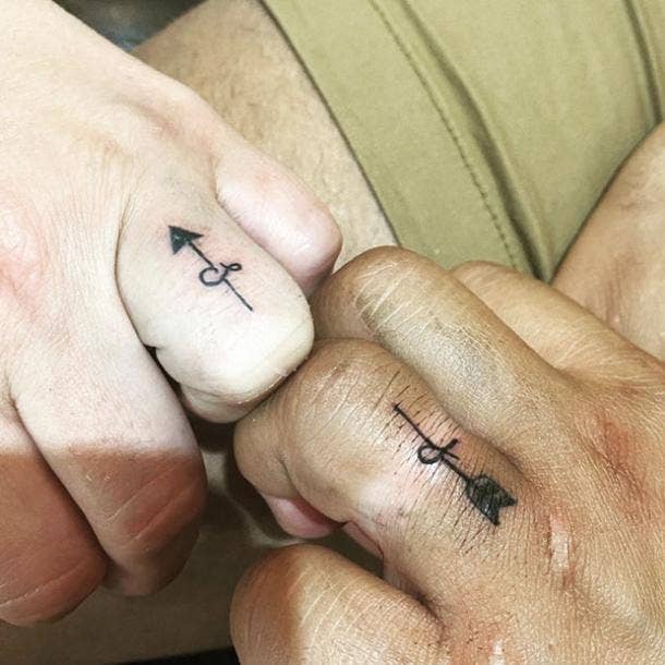 Arrow wedding ring tattoo