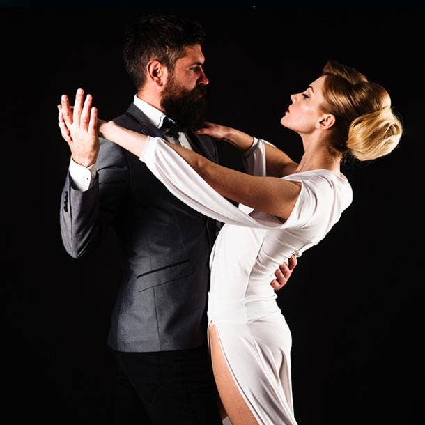 Couple dancers posing over white background. Dance school concept Stock  Photo - Alamy