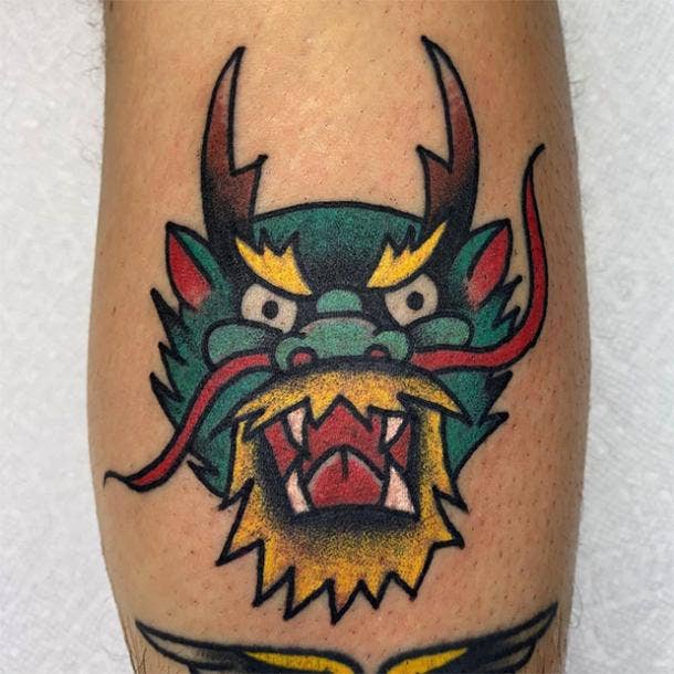 Dragon face tattoo