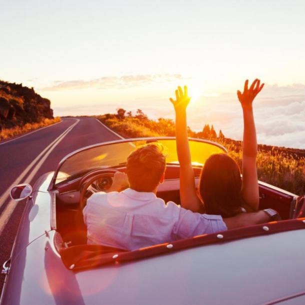 couple driving on winding road