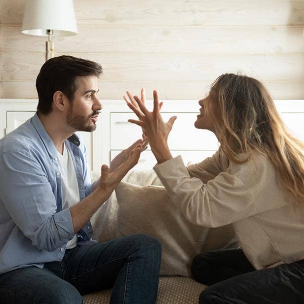 couple yelling sign he doesn't care about the relationship