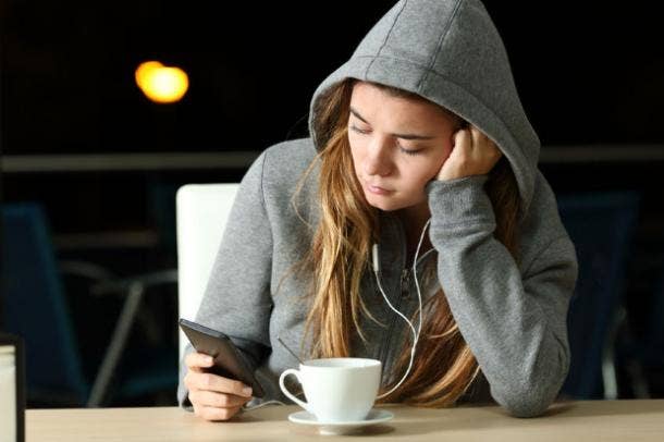 woman reading text from ex-boyfriend