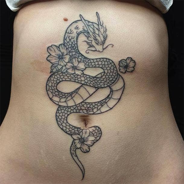Floral stomach dragon tattoo