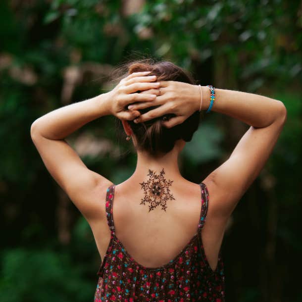 small mandala back tattoo