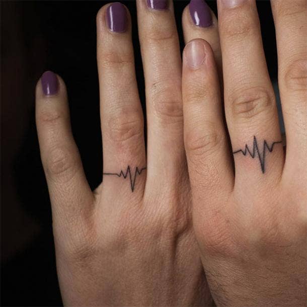 matching heartbeat wedding ring tattoo