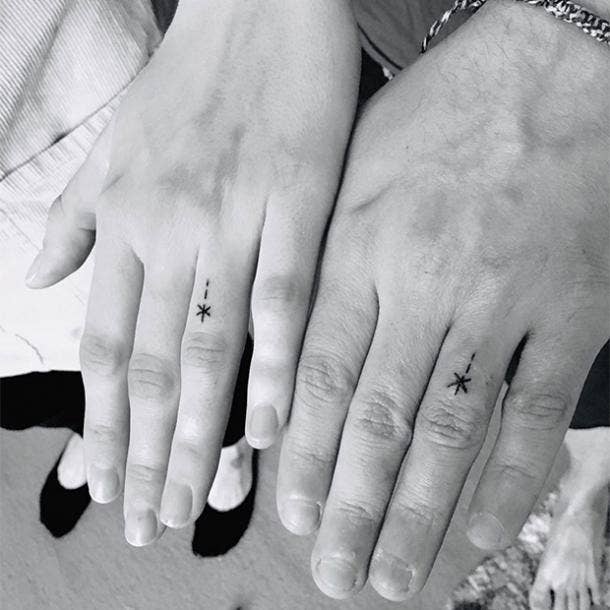 matching stars wedding ring tattoo