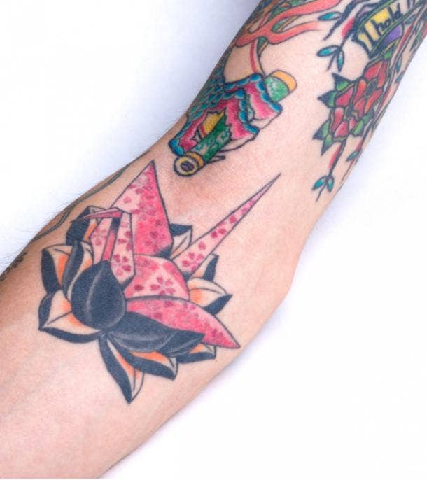 origami lotus tattoo idea for women