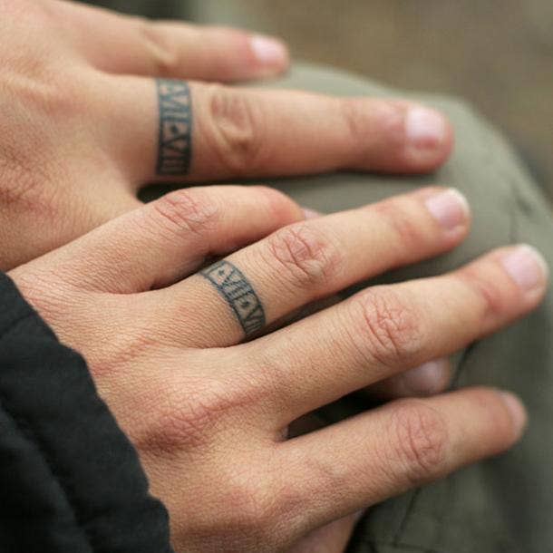 roman numeral wedding ring tattoo