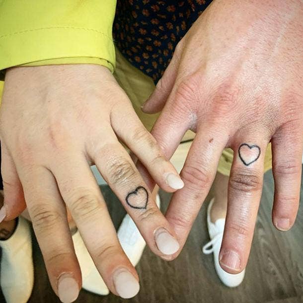 Simple heart wedding ring tattoo