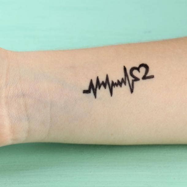 small tattoos with big meaning ekg waves