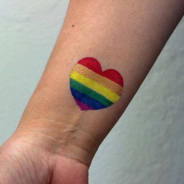 small tattoos with big meaning rainbow heart