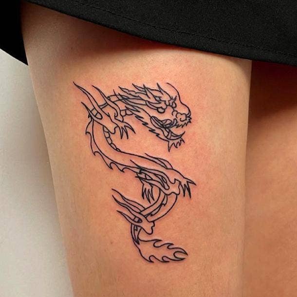Thigh dragon tattoo
