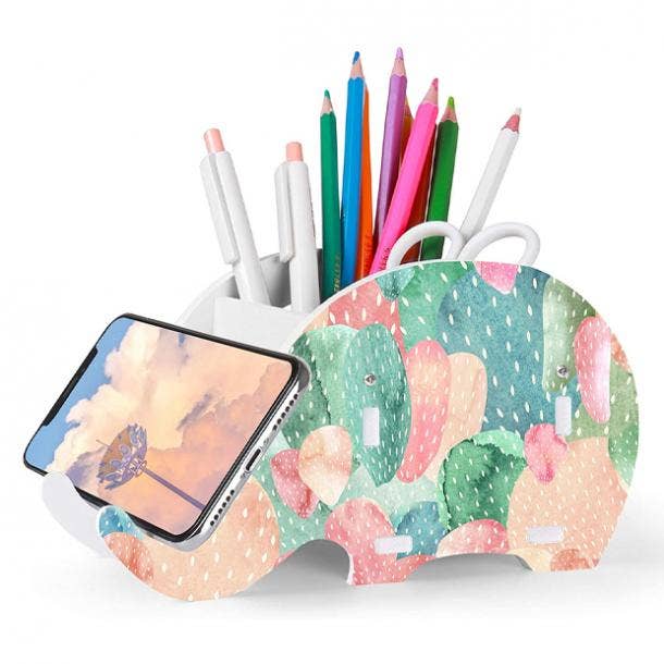 https://www.yourtango.com/sites/default/files/styles/body_image_default/public/2020/white-elephant-gifts-under-10-elephant-desk-supplies-organizer.jpg