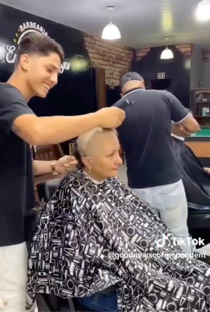 barber shaves mother's head prior to her chemo